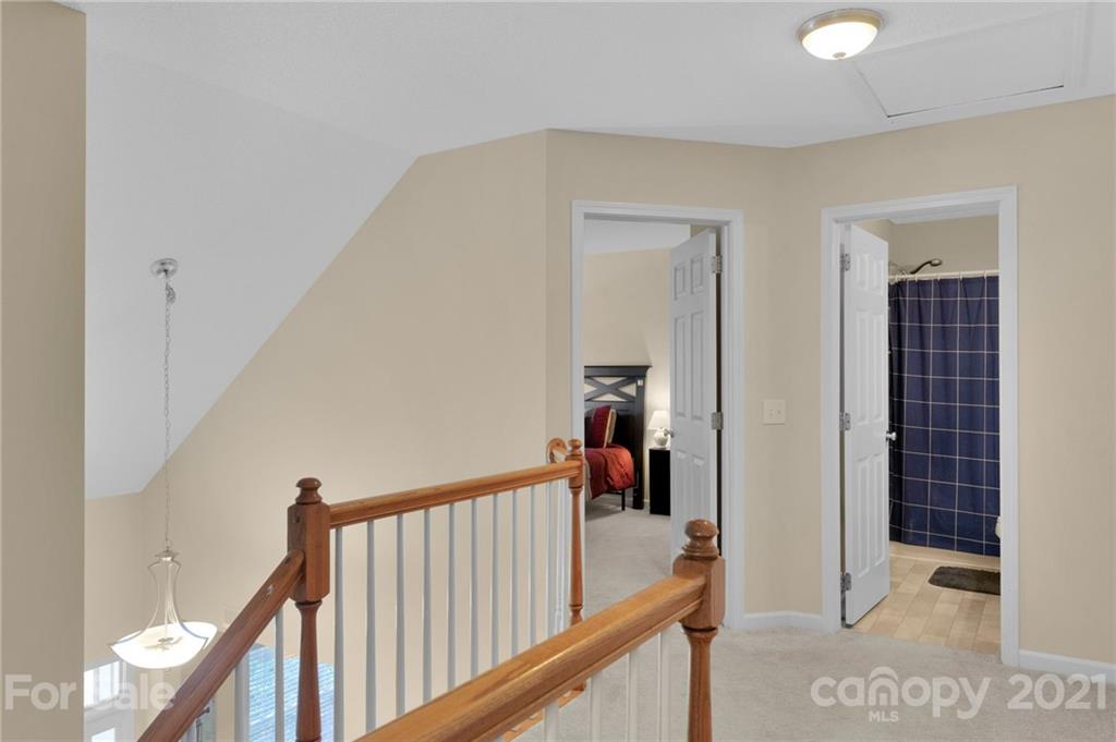 6925 Reedy Creek Road Charlotte, NC 28215 - Photo 27 of 34 a view of a hallway with a hallway and a livingroom with furniture