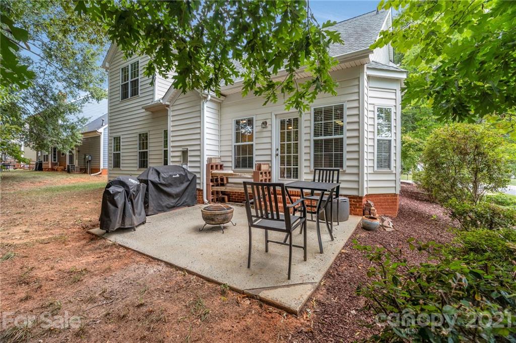 6925 Reedy Creek Road Charlotte, NC 28215 - Photo 29 of 34 a view of a patio with a table and chairs