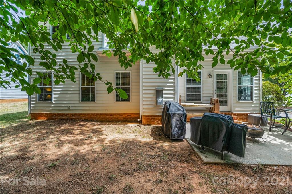 6925 Reedy Creek Road Charlotte, NC 28215 - Photo 30 of 34 a view of backyard with outdoor seating and trees