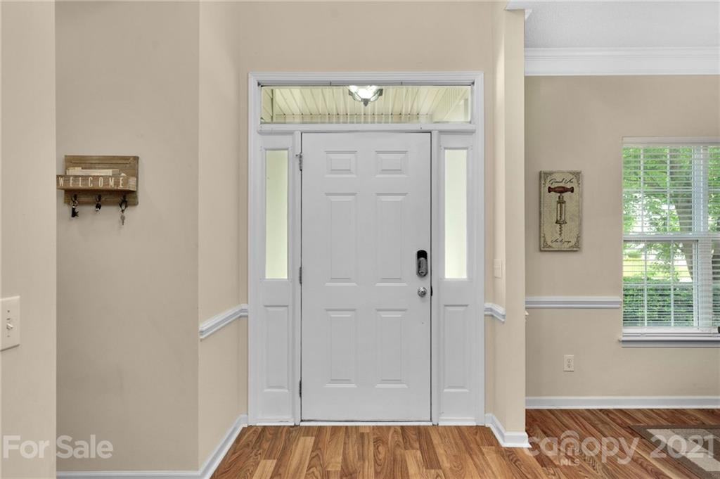 6925 Reedy Creek Road Charlotte, NC 28215 - Photo 4 of 34 a bedroom with a bed and a window