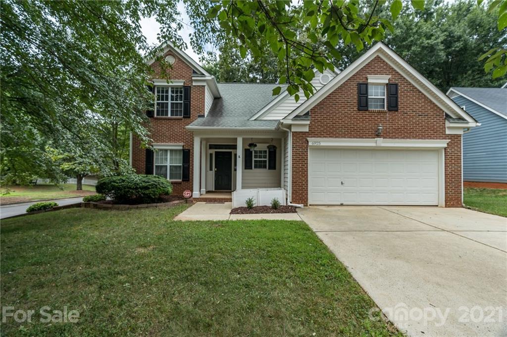 6925 Reedy Creek Road Charlotte, NC 28215 - Photo 33 of 34 a front view of a house with a yard and porch