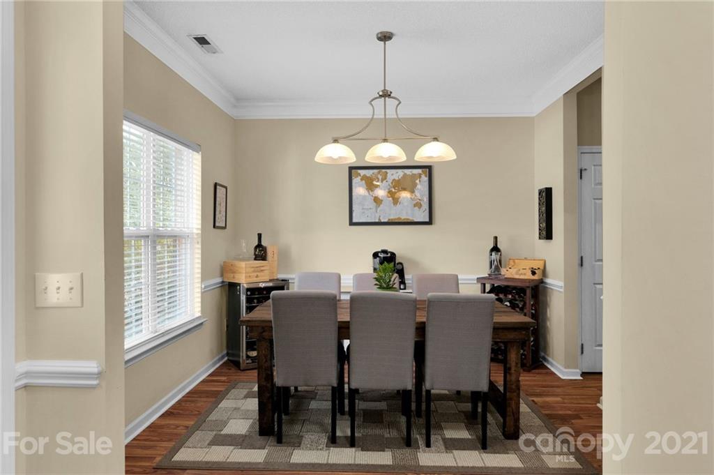 6925 Reedy Creek Road Charlotte, NC 28215 - Photo 6 of 34 a view of a dining room with furniture window and outside view