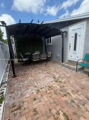 a front view of a house with a chair