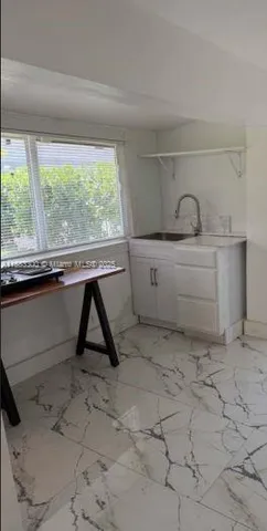 a view of a room with a window and storage