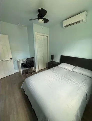 a bedroom with a bed and cabinets