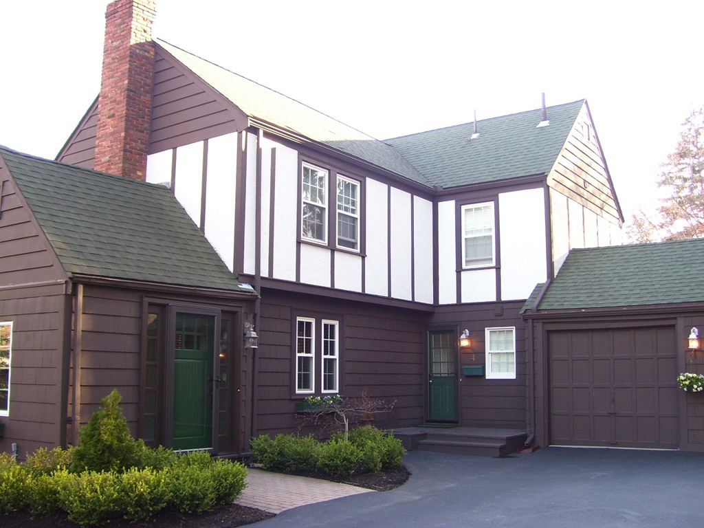 4 Roberts Road Wellesley, MA 02481 - Photo 4 of 29 a front view of a house with a garage