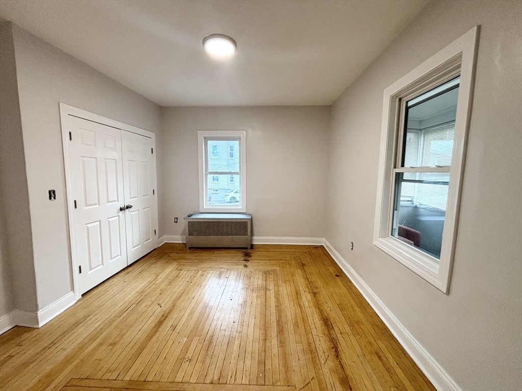 35 Madison Street Malden, MA 02148 - Photo 6 of 16 a view of a livingroom with wooden floor and a window