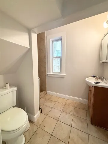 a bathroom with a toilet and a sink