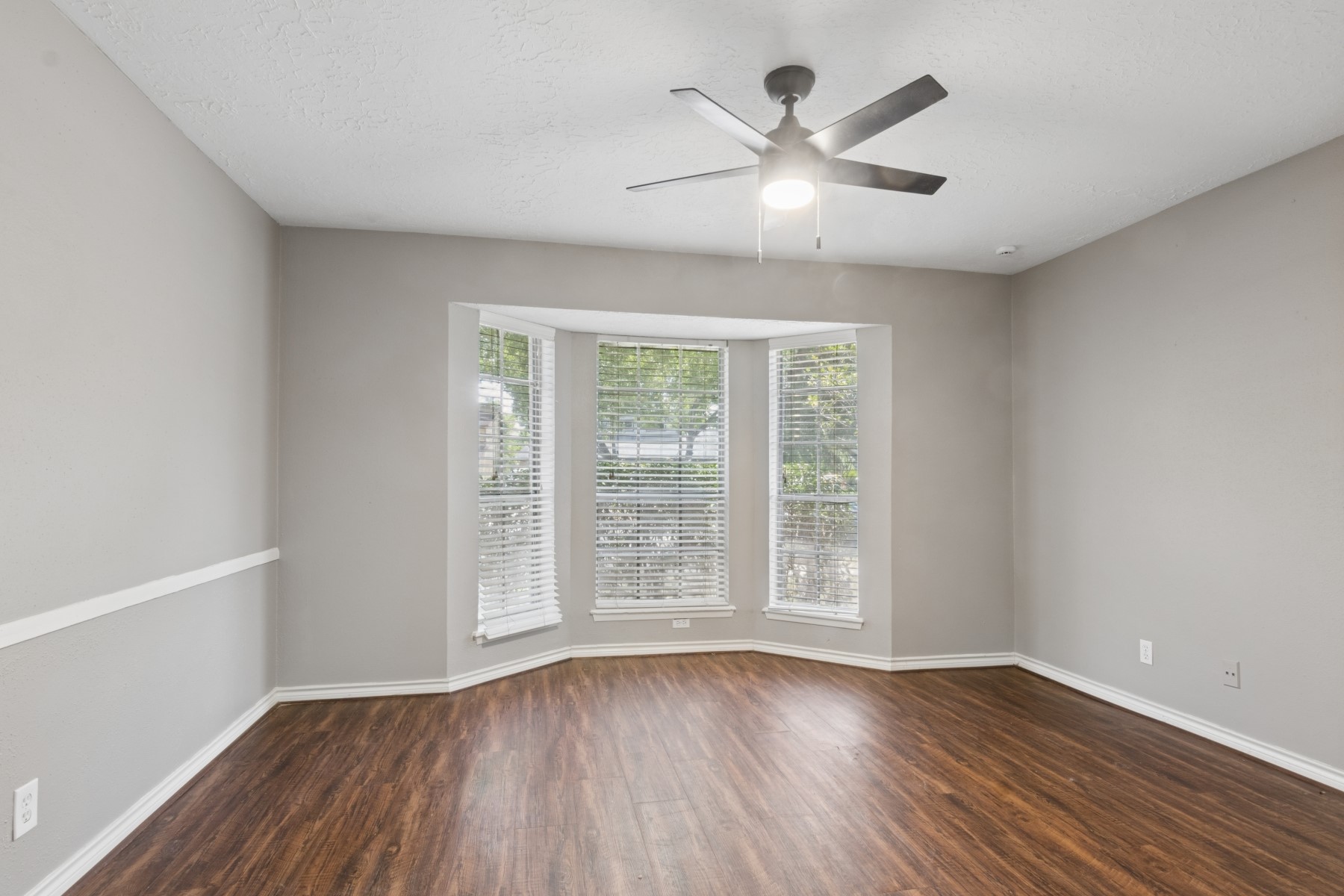 2607 Allyson Court Spring, TX 77373 - Photo 12 of 25 wooden floor in an empty room with a window