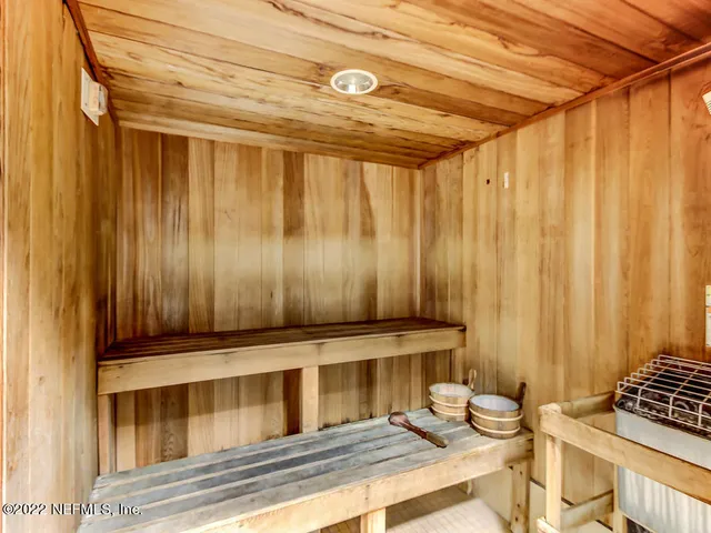 a kitchen with granite countertop a refrigerator stove and sink