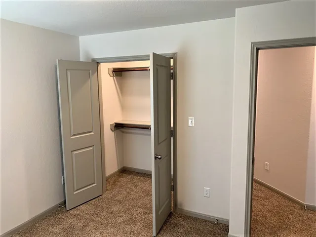 a view of a hallway with closet