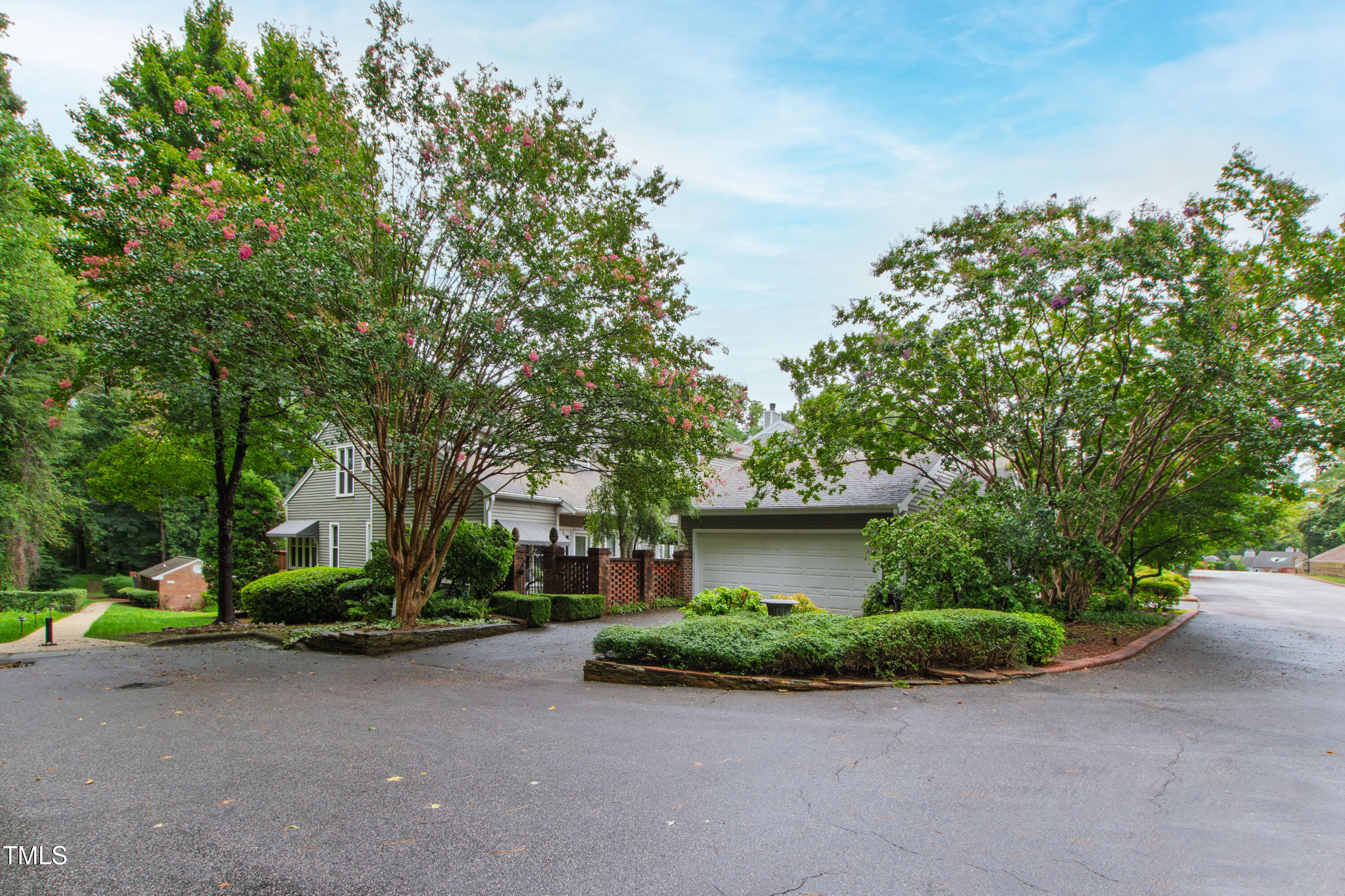 2301 Upper Oaks Way Raleigh, NC 27615 - Photo 1 of 55 a front view of a house with garden