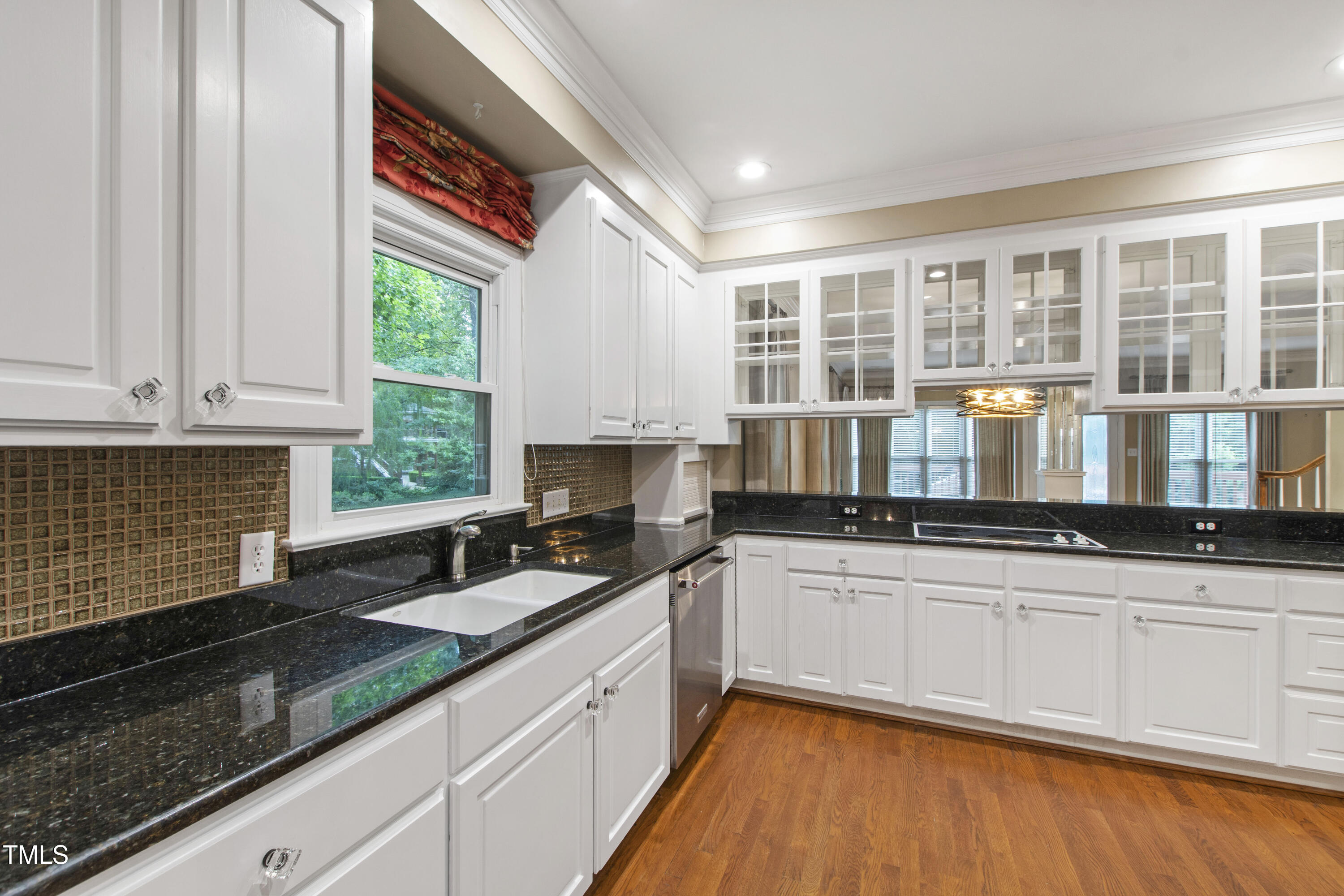 2301 Upper Oaks Way Raleigh, NC 27615 - Photo 13 of 55 a kitchen with granite countertop a sink and a stove