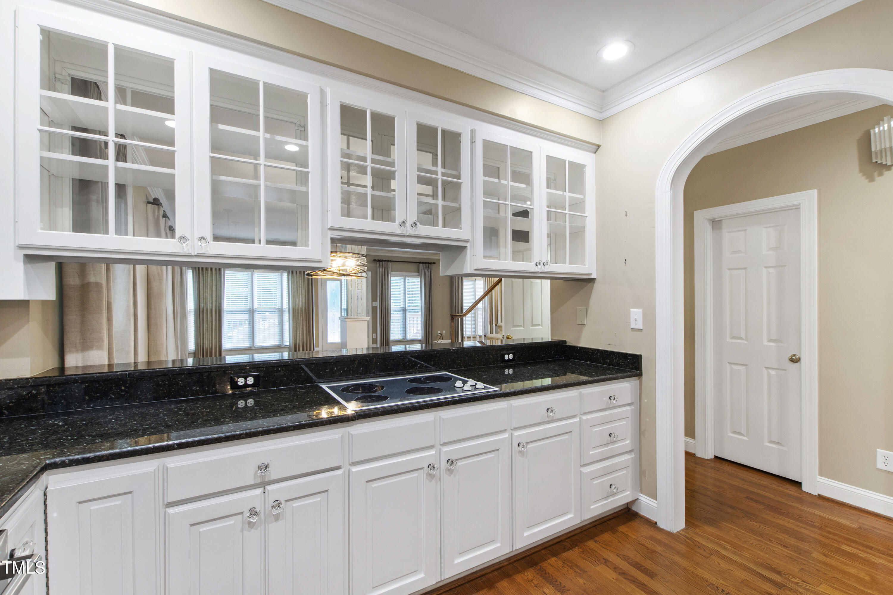 2301 Upper Oaks Way Raleigh, NC 27615 - Photo 14 of 55 a kitchen with granite countertop a stove and cabinets