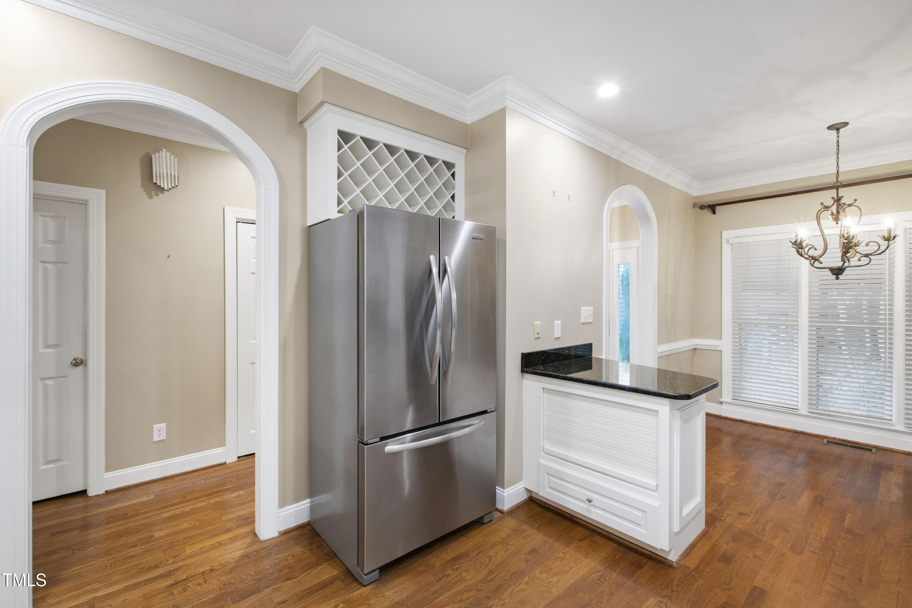2301 Upper Oaks Way Raleigh, NC 27615 - Photo 17 of 55 a kitchen with stainless steel appliances granite countertop a refrigerator and a wooden floor