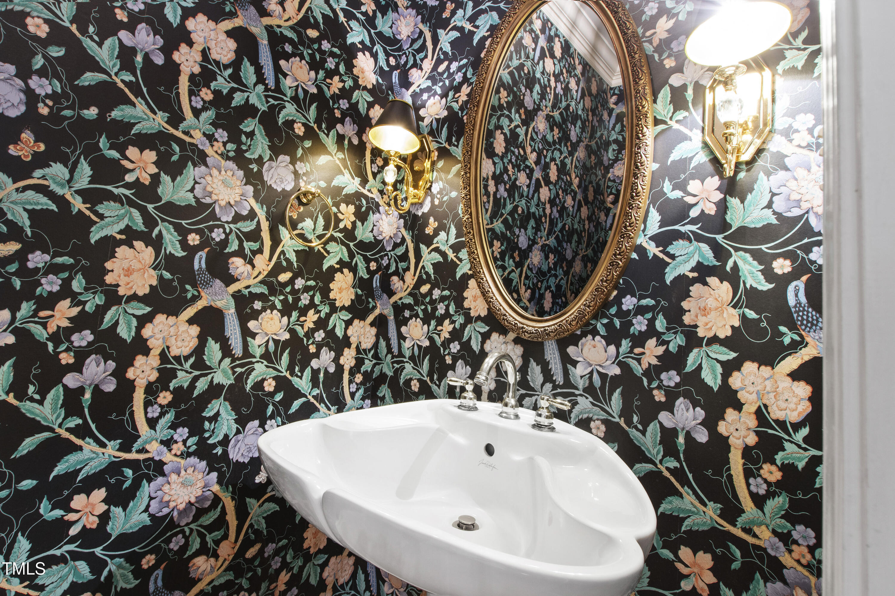 2301 Upper Oaks Way Raleigh, NC 27615 - Photo 19 of 55 a bathroom with a sink and mirror