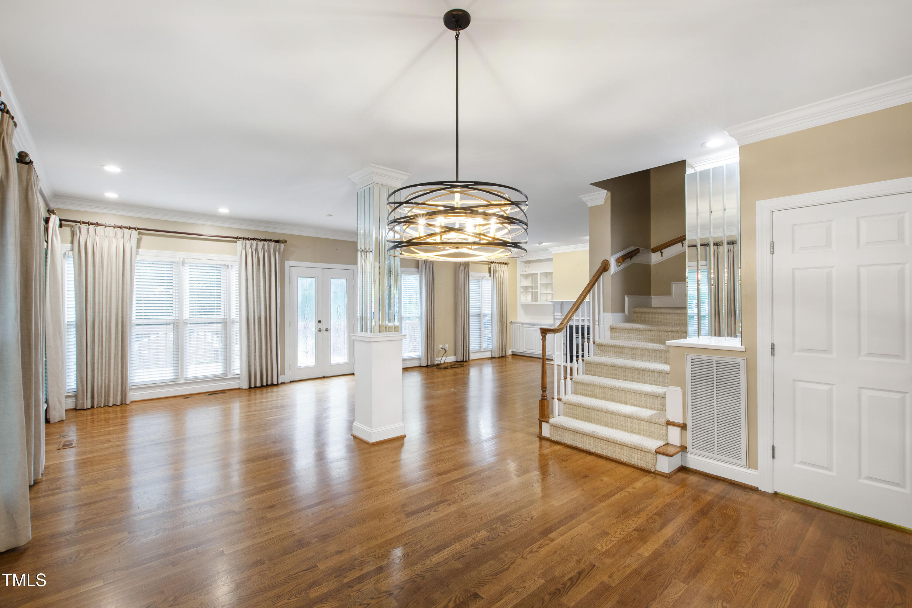 2301 Upper Oaks Way Raleigh, NC 27615 - Photo 21 of 55 a view of an empty room with wooden floor and a window