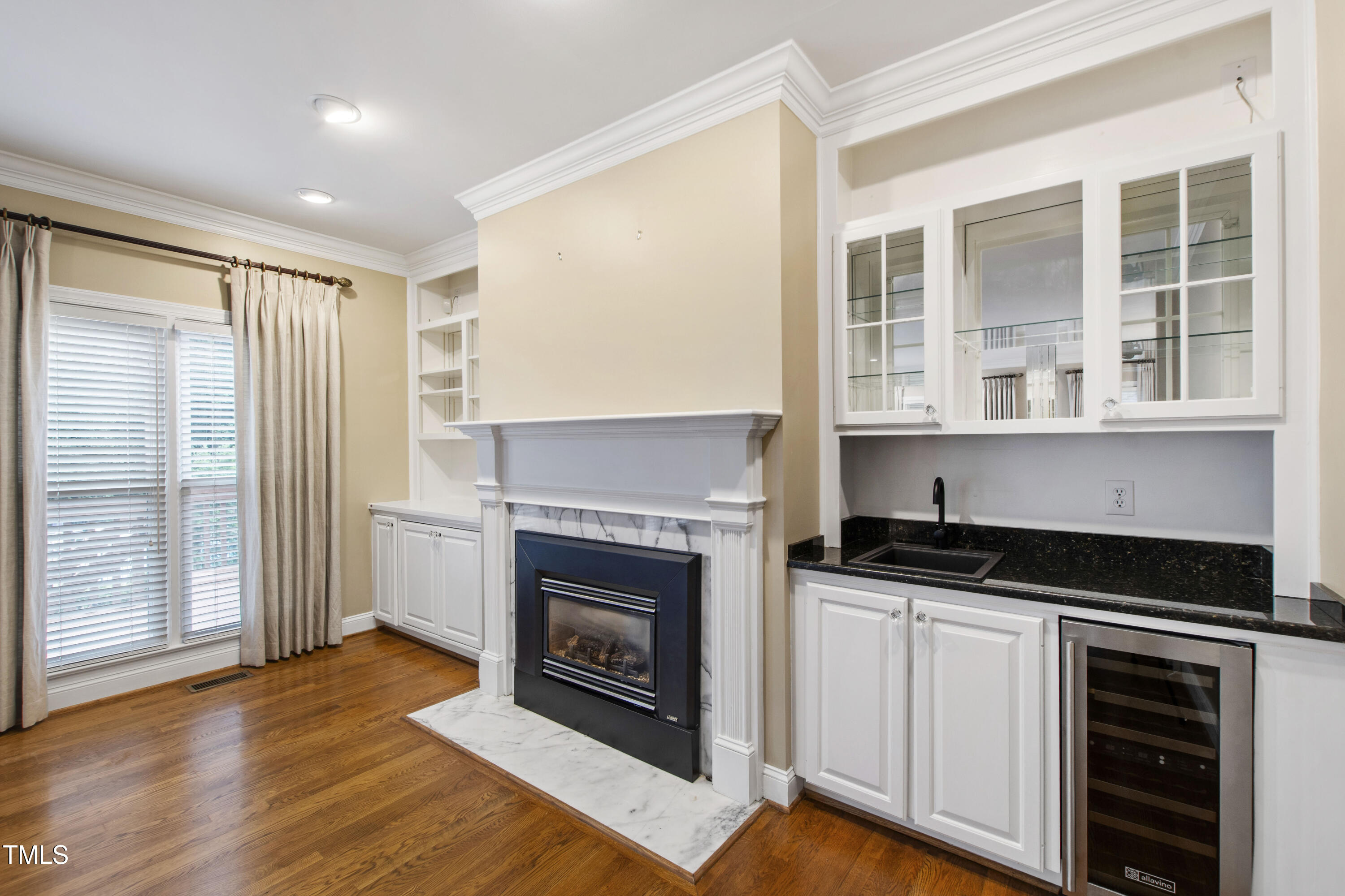 2301 Upper Oaks Way Raleigh, NC 27615 - Photo 25 of 55 a kitchen with granite countertop a stove fireplace and a window