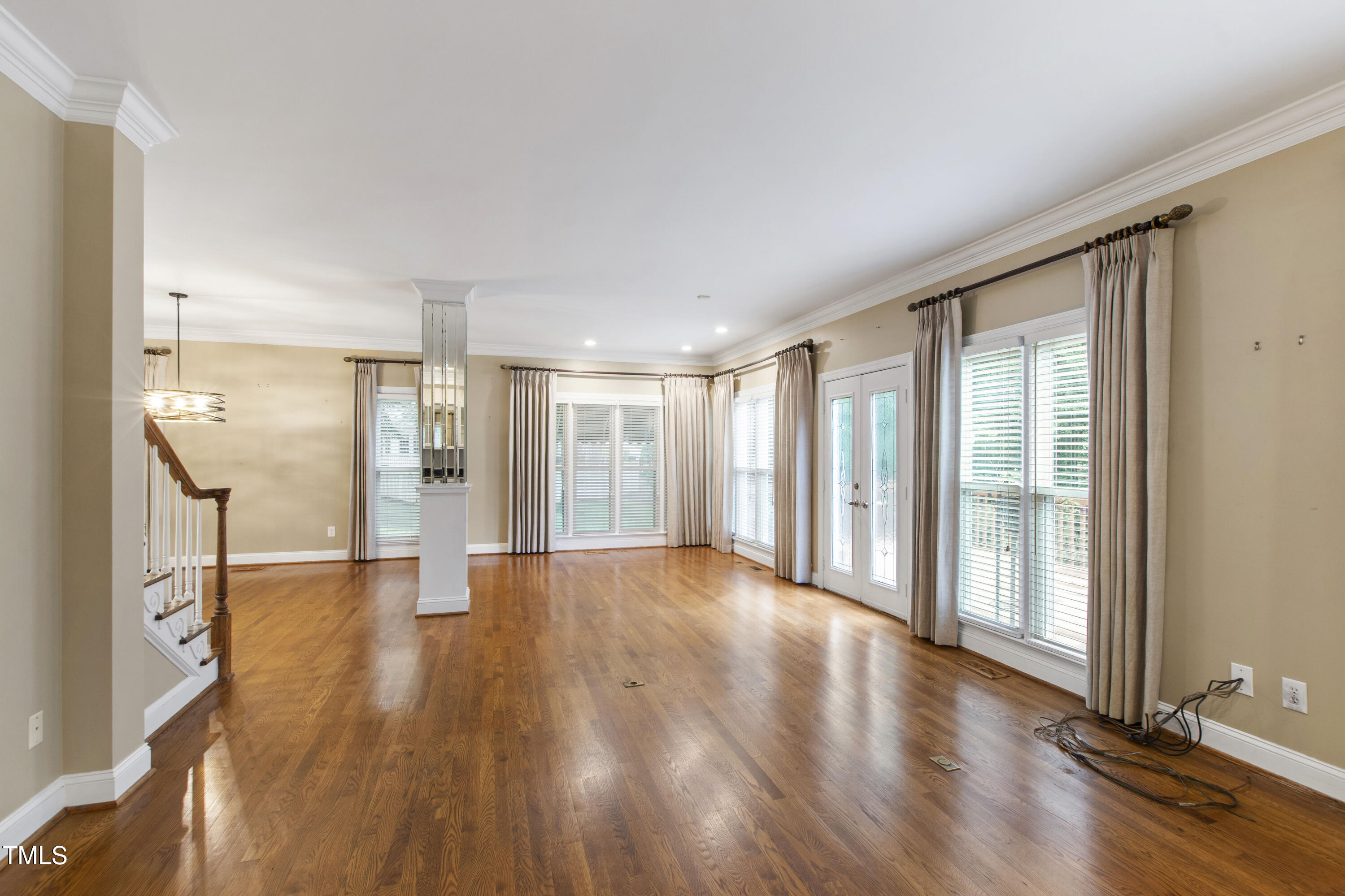 2301 Upper Oaks Way Raleigh, NC 27615 - Photo 26 of 55 a view of an empty room with wooden floor and a window