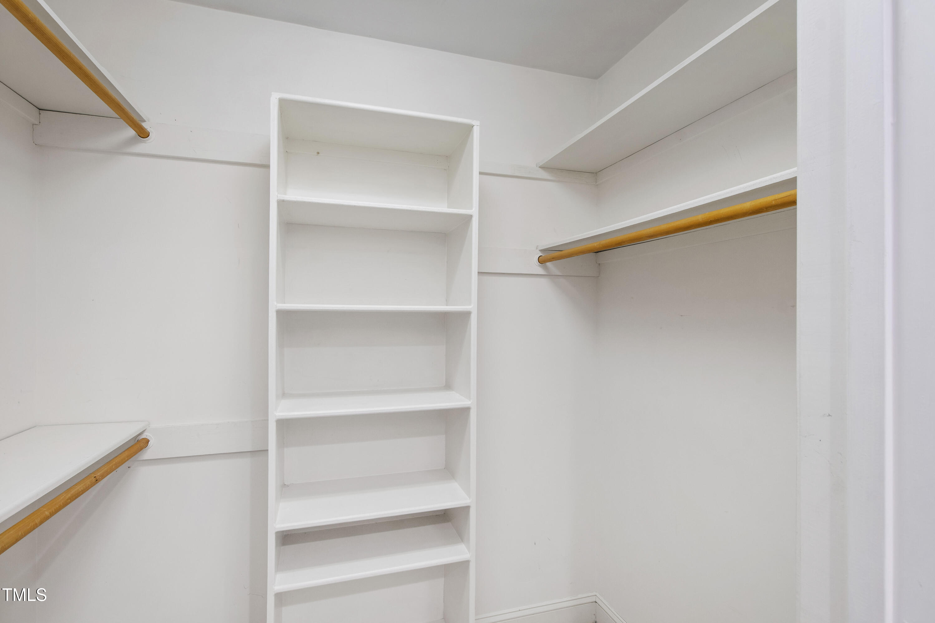 2301 Upper Oaks Way Raleigh, NC 27615 - Photo 41 of 55 a view of walk in closet with empty racks