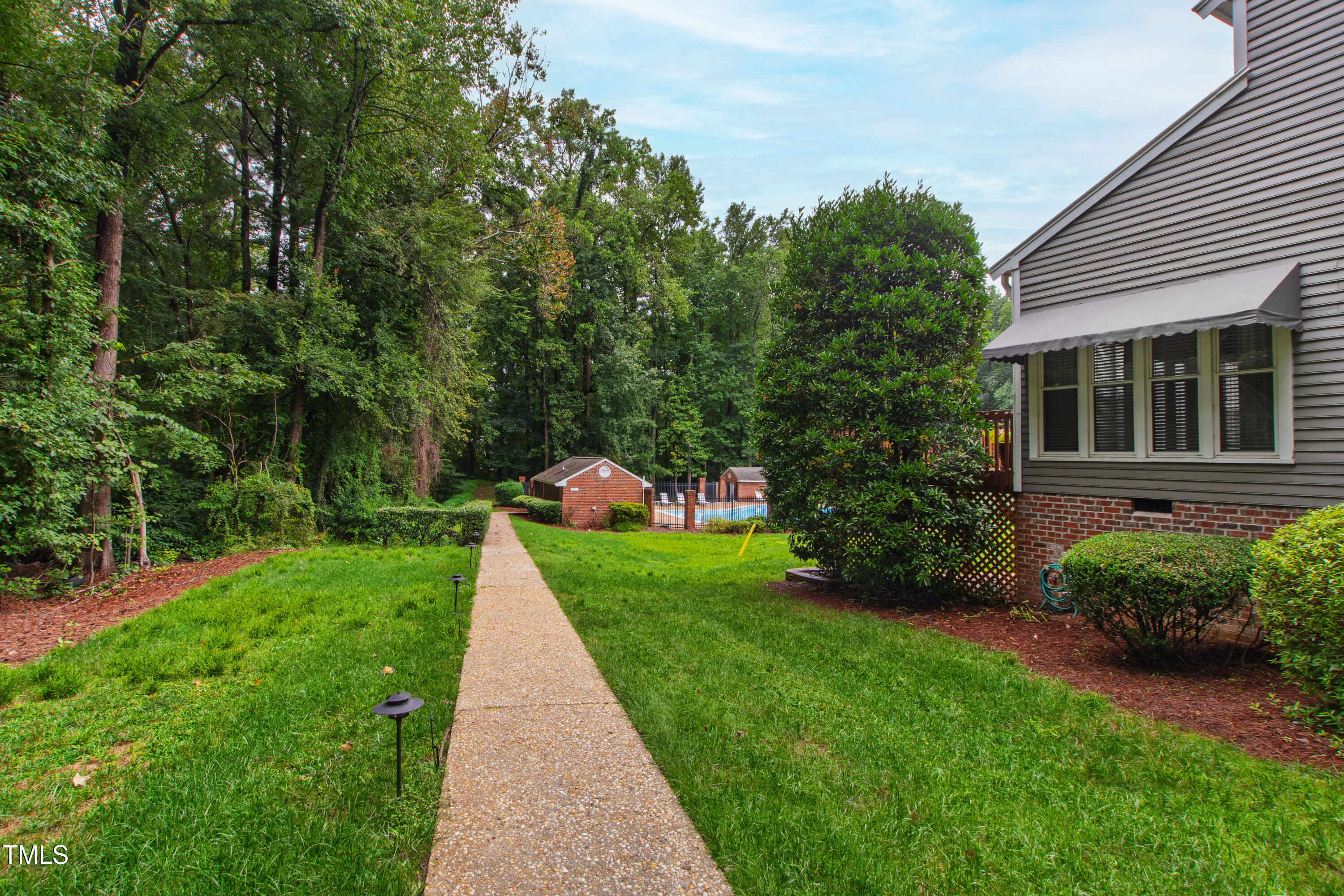 2301 Upper Oaks Way Raleigh, NC 27615 - Photo 50 of 55 a view of a house with a yard