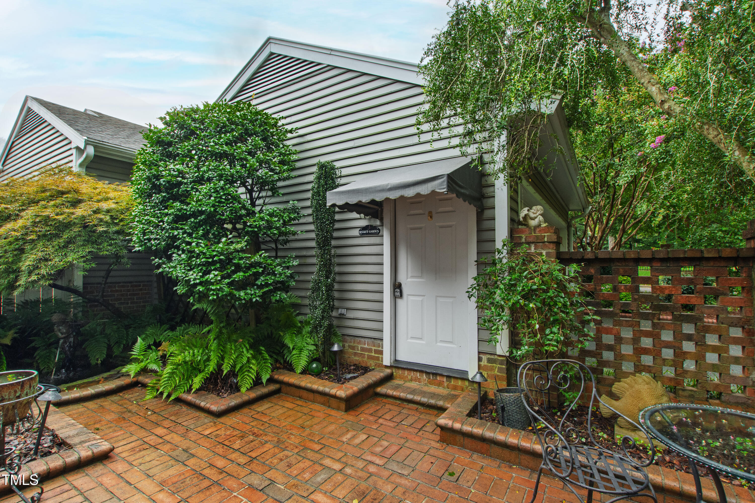 2301 Upper Oaks Way Raleigh, NC 27615 - Photo 7 of 55 a backyard of a house with lots of green space