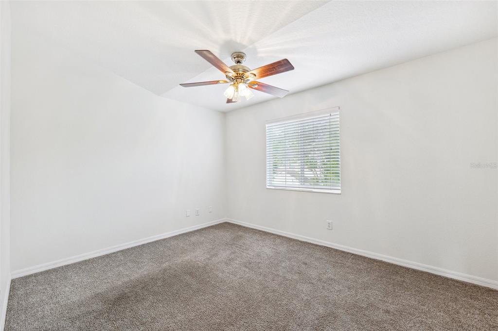 3209 Meta Court Largo, FL 33771 - Photo 12 of 24 an empty room with windows and fan