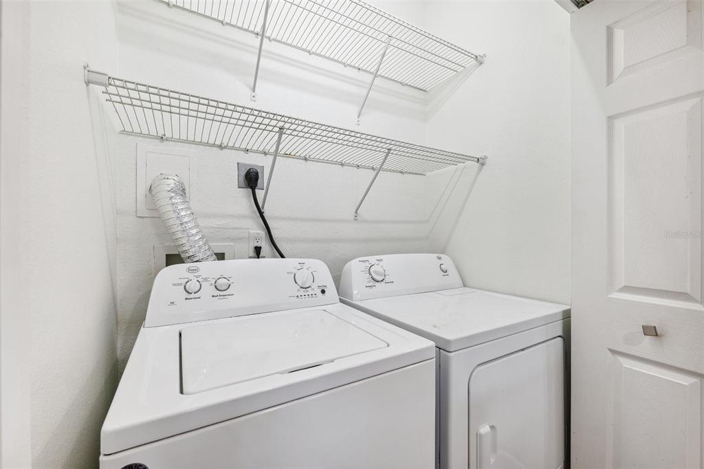 3209 Meta Court Largo, FL 33771 - Photo 6 of 24 a utility room with dryer and washer