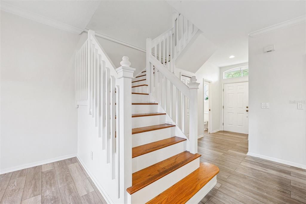 3209 Meta Court Largo, FL 33771 - Photo 8 of 24 a view of entryway with wooden floor