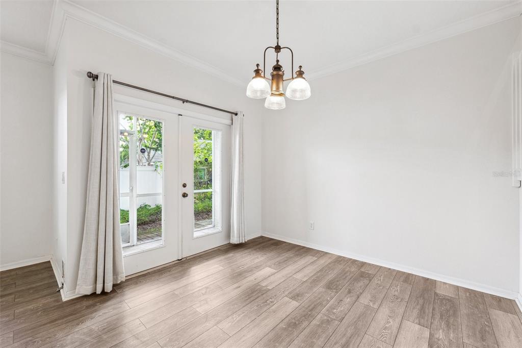 3209 Meta Court Largo, FL 33771 - Photo 10 of 24 a view of an empty room with wooden floor and a window