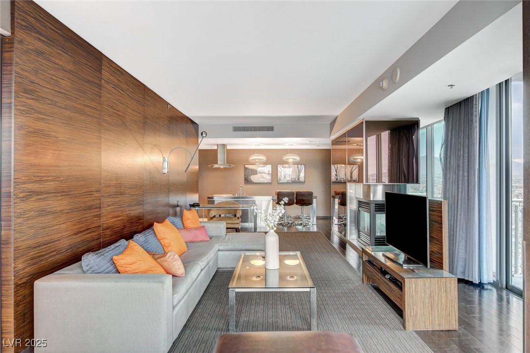 4381 West Flamingo Road, Unit 2202 Las Vegas, NV 89103 - Photo 8 of 40 Living room featuring wood finished floors