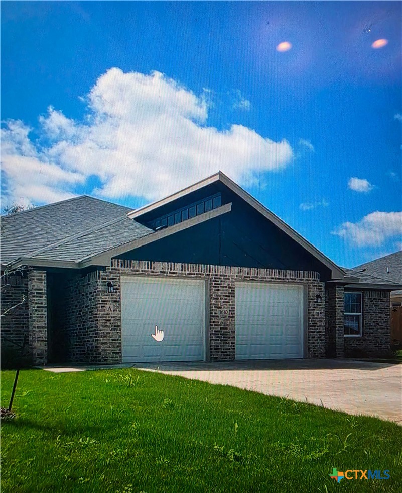1610 Pima Trail, Unit A Harker Heights, TX 76548 - Photo 1 of 22 a front view of a house with a yard