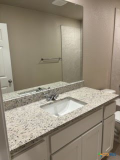 1610 Pima Trail, Unit A Harker Heights, TX 76548 - Photo 15 of 22 a bathroom with a granite countertop sink and a mirror
