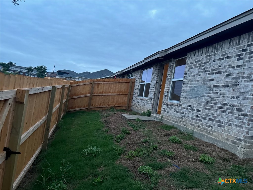 1610 Pima Trail, Unit A Harker Heights, TX 76548 - Photo 22 of 22 a view of a backyard with plants and a patio