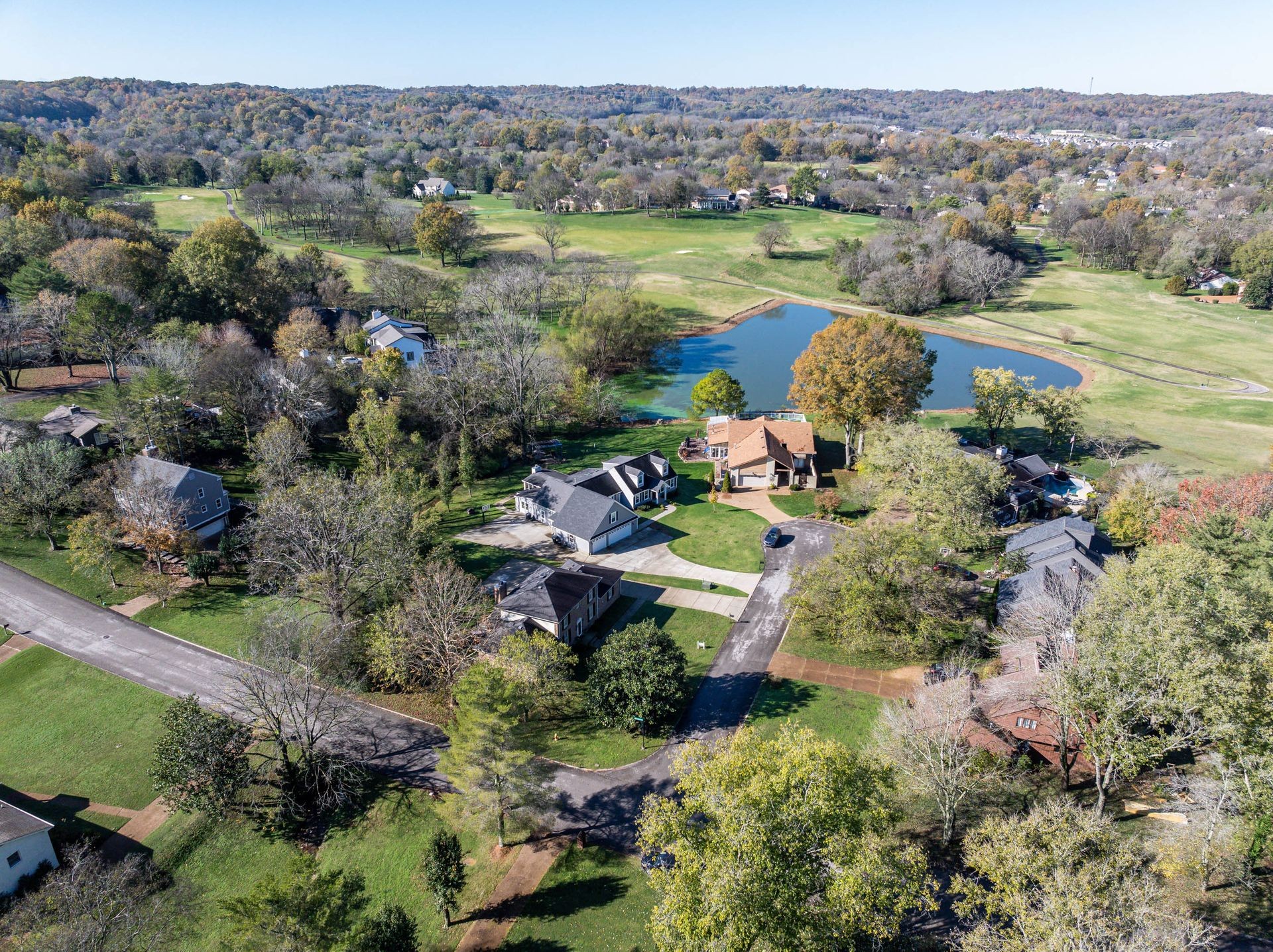 101 Pinehurst Drive Franklin, TN 37069 - Photo 2 of 41 an aerial view of a houses with a lush green hillside
