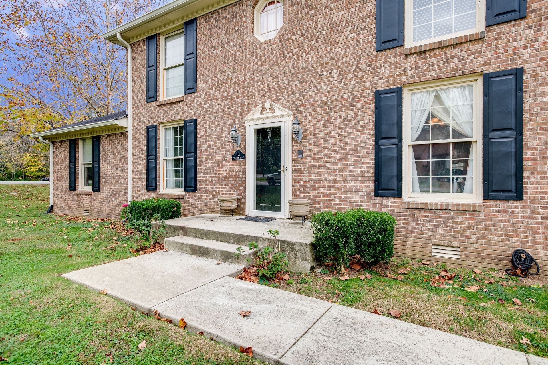 101 Pinehurst Drive Franklin, TN 37069 - Photo 38 of 41 front view of a brick house with a yard