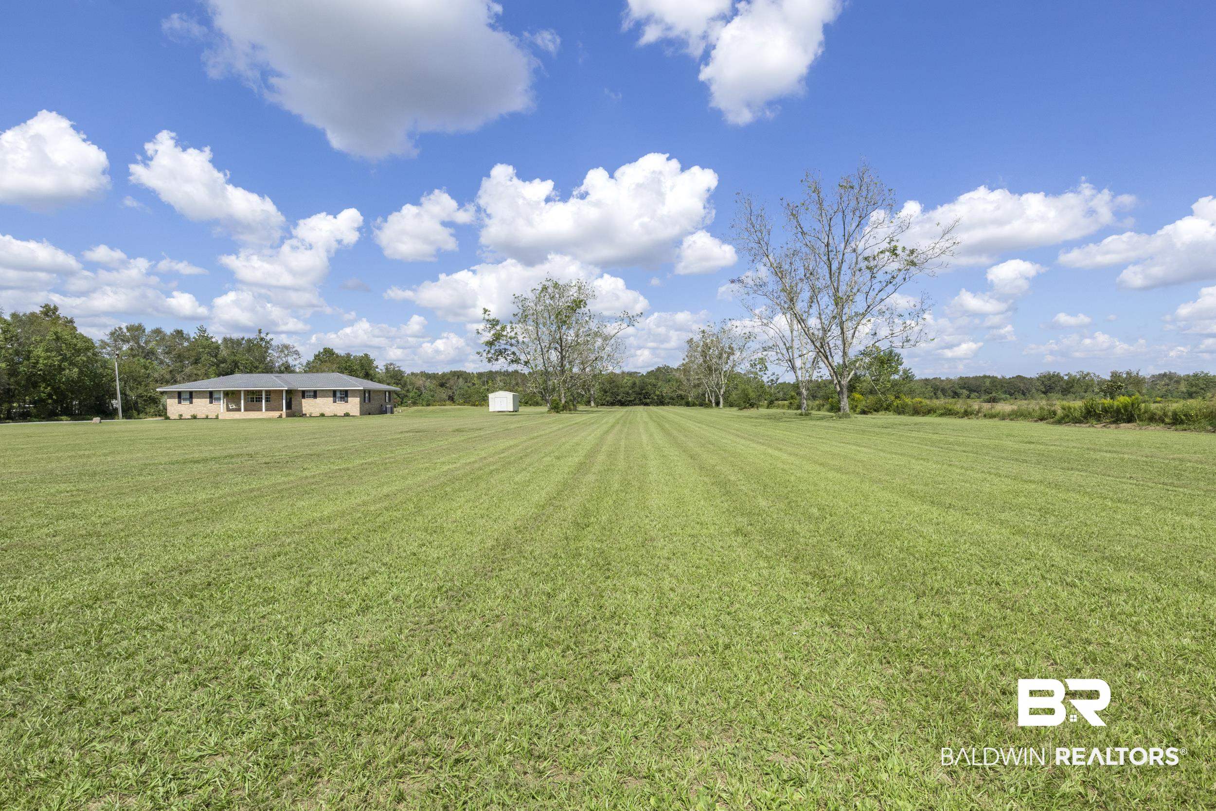 17689 Brewer Road Foley, AL 36535 - Photo 17 of 54 View of yard featuring a rural view