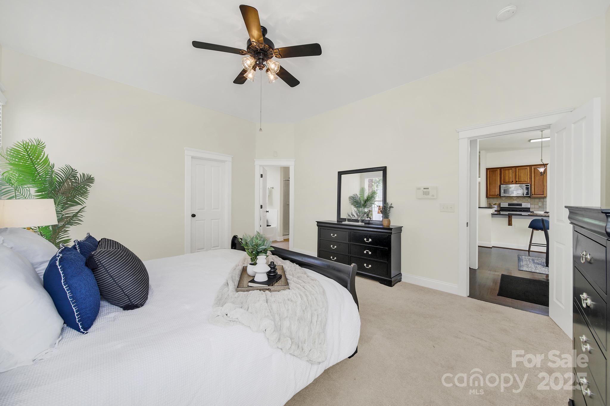 1855 2nd Baxter Crossing Fort Mill, SC 29708 - Photo 17 of 48 a bedroom with a bed and ceiling fan