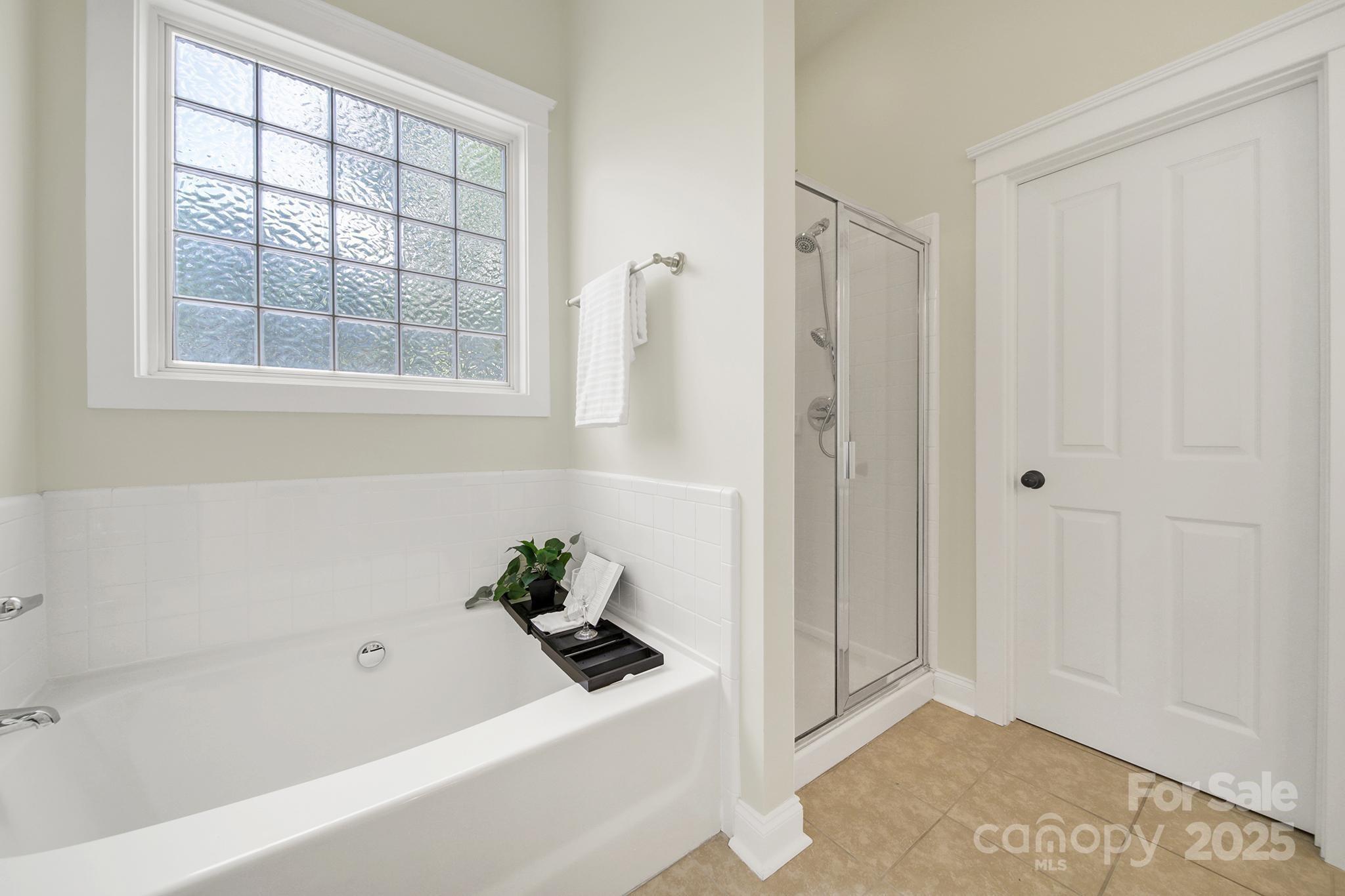 1855 2nd Baxter Crossing Fort Mill, SC 29708 - Photo 20 of 48 a bathroom with a bathtub and shower