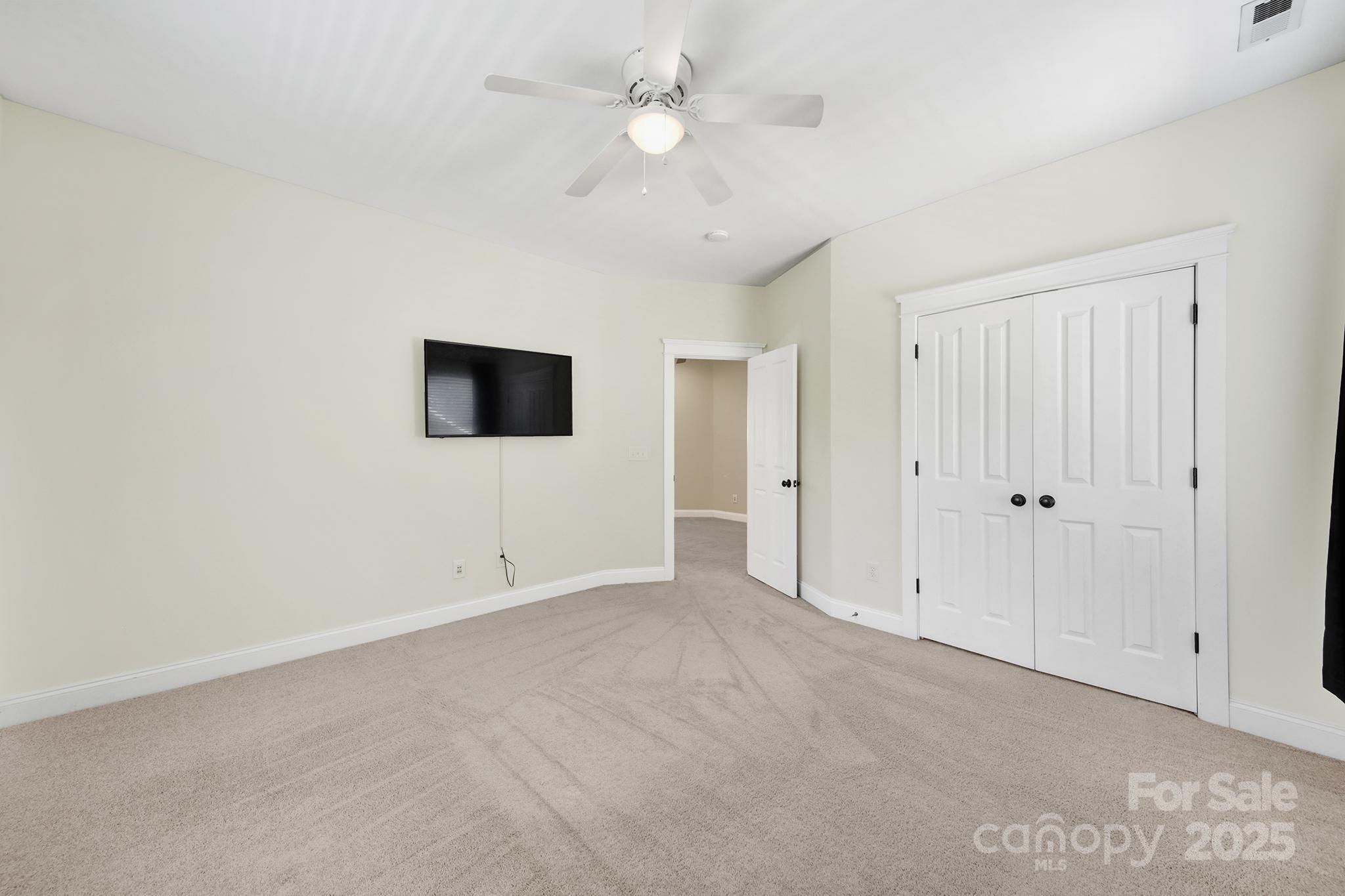 1855 2nd Baxter Crossing Fort Mill, SC 29708 - Photo 24 of 48 a view of an empty room with a ceiling fan