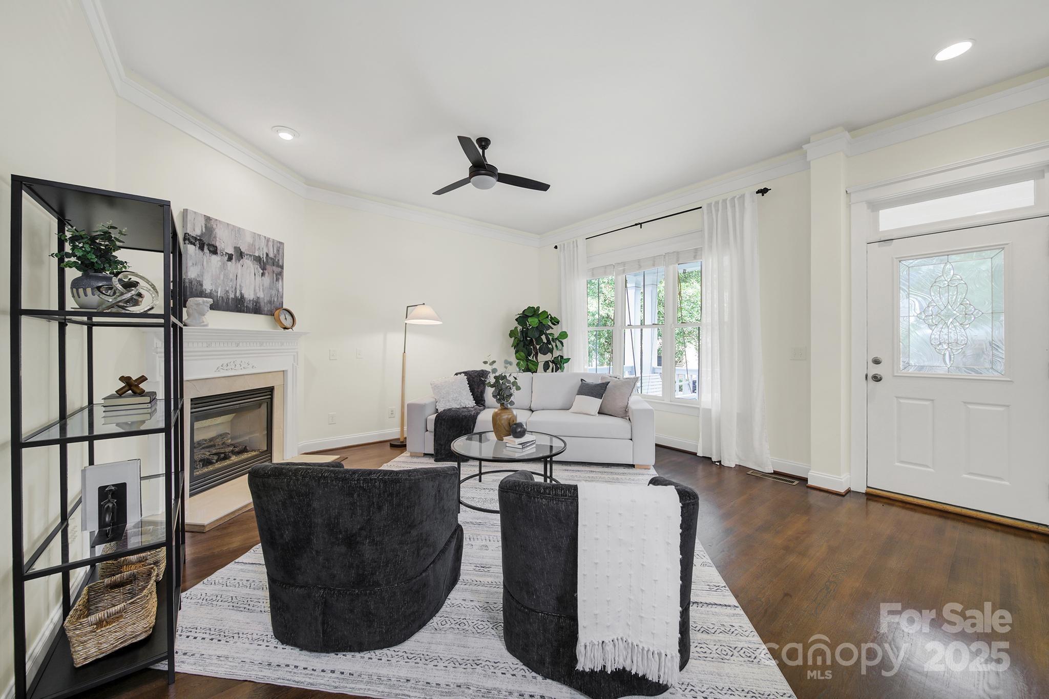 1855 2nd Baxter Crossing Fort Mill, SC 29708 - Photo 3 of 48 a living room with fireplace furniture and a window