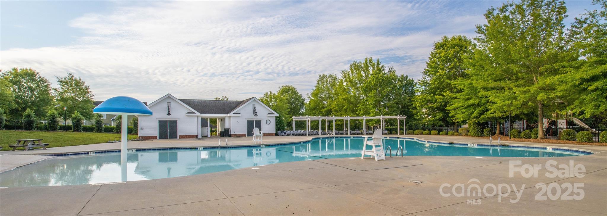 1855 2nd Baxter Crossing Fort Mill, SC 29708 - Photo 43 of 48 an outdoor view of house with swimming pool and trees around