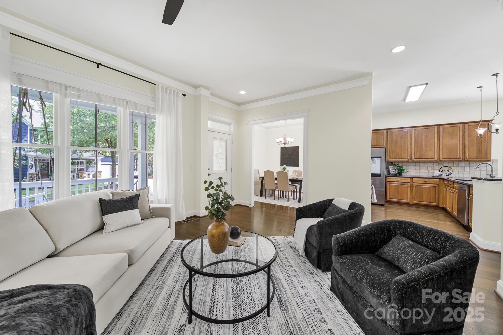 1855 2nd Baxter Crossing Fort Mill, SC 29708 - Photo 5 of 48 a living room with furniture and a large window