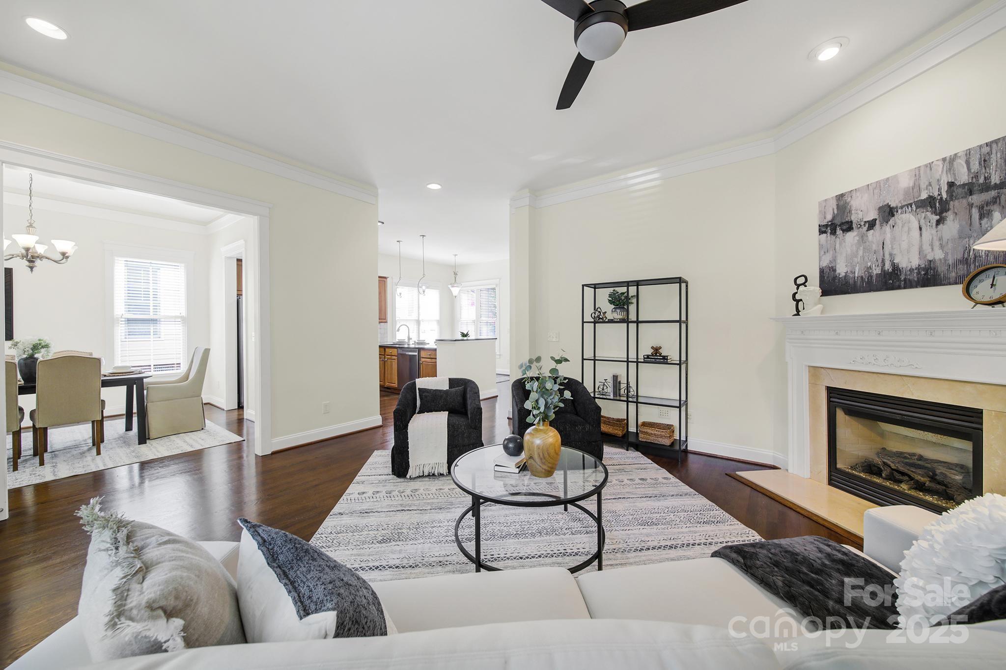 1855 2nd Baxter Crossing Fort Mill, SC 29708 - Photo 6 of 48 a living room with furniture and a fireplace