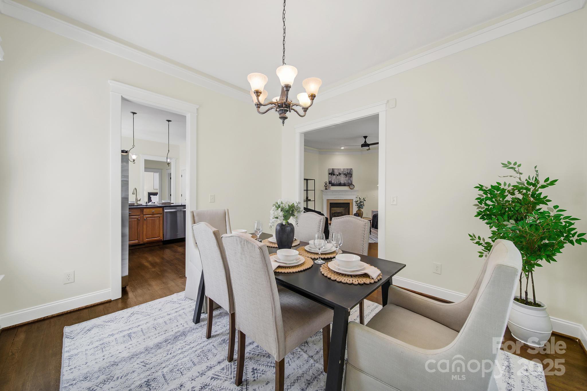 1855 2nd Baxter Crossing Fort Mill, SC 29708 - Photo 7 of 48 a view of a dining room with furniture and a potted plant
