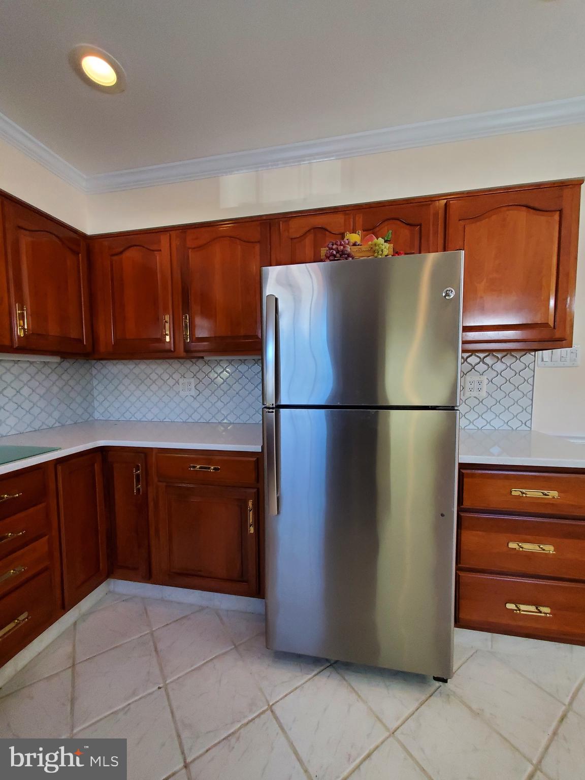 11865 Sewell Road Philadelphia, PA 19116 - Photo 14 of 41 a kitchen with a refrigerator and cabinets