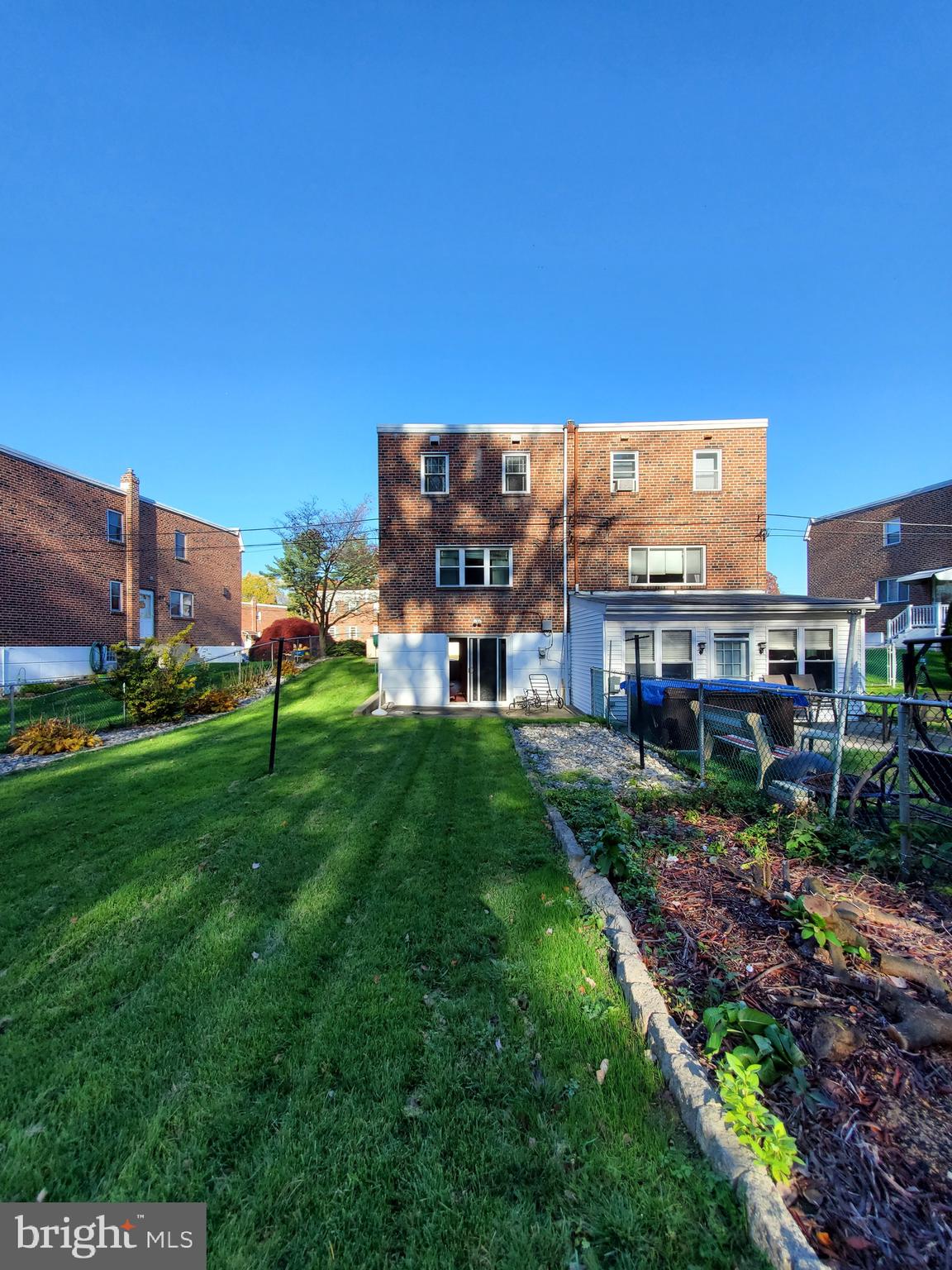 11865 Sewell Road Philadelphia, PA 19116 - Photo 40 of 41 a view of a big yard with a building in the background