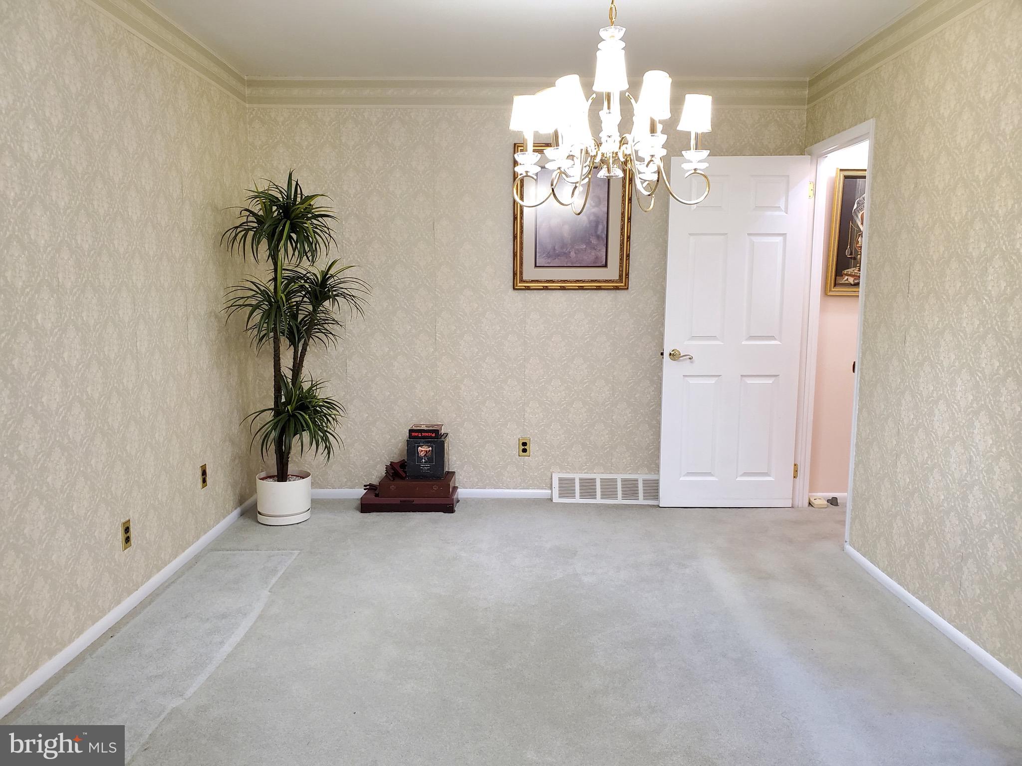 11865 Sewell Road Philadelphia, PA 19116 - Photo 9 of 41 a view of an empty room with a chandelier