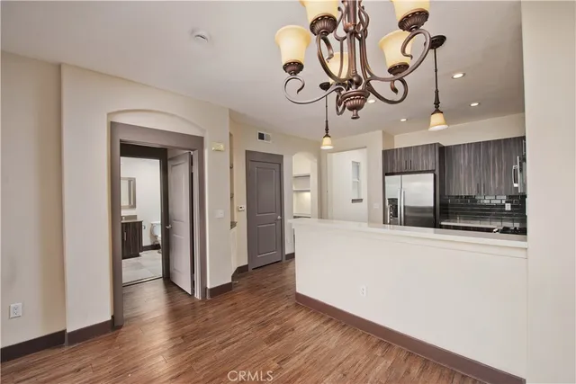 a view of a kitchen and a window