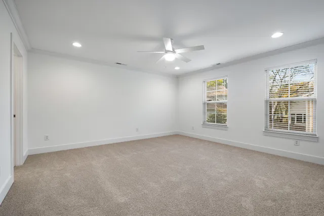 a bathroom with a glass shower door and mirror